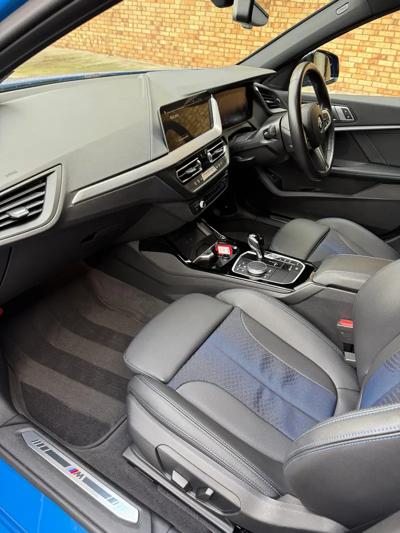BMW cabin with deep-cleaned seats and carpets after a full interior detail